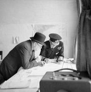Winston_Churchill_studies_after_action_reports_with_Vice_Admiral_Sir_Bertram_Ramsay,_Flag_Officer_Comanding_Dover,_28_August_1940.jpg