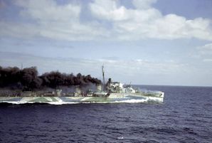 British_destroyer_HMS_Harvester_escorting_a_convoy_en_route_to_Great_Britain_from_the_U.S_seen_from_the_deck_of_a_Cunard_freight_ship,_1941..jpg