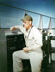 Commanding_Officer_Captain_Kenneth_H_Noble_on_the_bridge_circa_February_1945.jpg